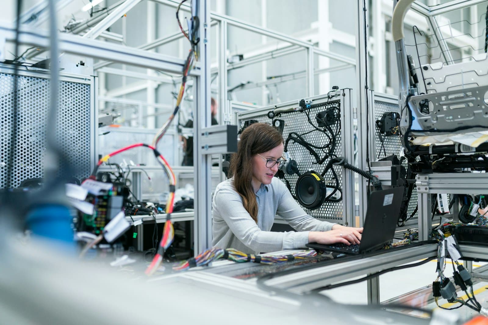Technician testing portable electrical equipment and recording results